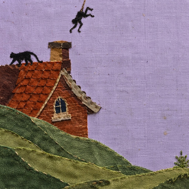 Cover art for 27 Years Old: a stitched fabric collage of a red-tiled cottage on green hills under a lilac sky, a black cat on the roof and a small dark figure tumbling past the chimney